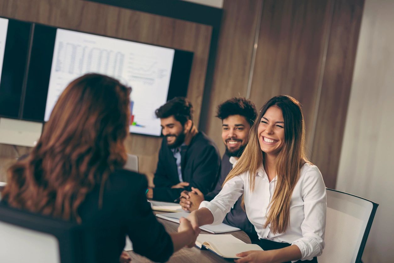 Colleagues working together in a conference room.